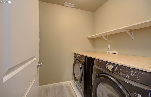 9513 NE 73rd St, Vancouver, WA 98662 - laundry room featuring independent washer and dryer, light wood-style floors, and baseboards