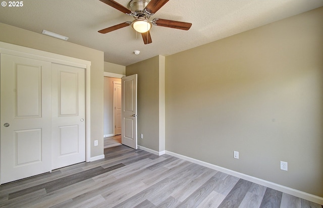 9513 NE 73rd St, Vancouver, WA 98662 - unfurnished bedroom with light wood finished floors, baseboards, a closet, and a ceiling fan