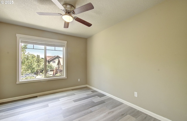 9513 NE 73rd St, Vancouver, WA 98662 - empty room featuring light wood-type flooring, a textured ceiling, baseboards, and a ceiling fan