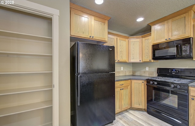 9513 NE 73rd St, Vancouver, WA 98662 - kitchen with black appliances, light wood-type flooring, dark countertops, light brown cabinetry, and recessed lighting