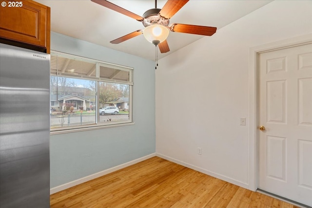 unfurnished room with light hardwood / wood-style floors and ceiling fan