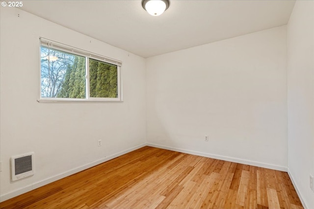 unfurnished room featuring hardwood / wood-style floors