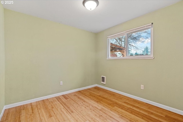 unfurnished room with light hardwood / wood-style flooring