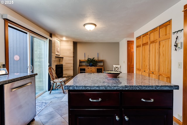 kitchen with tile counters and a fireplace