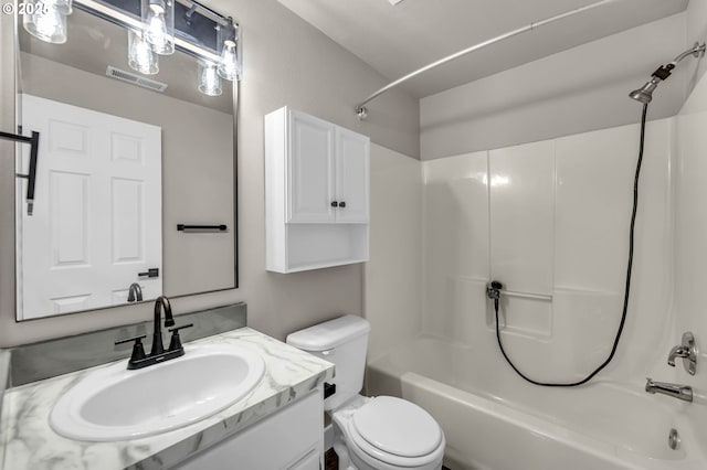 full bathroom with vanity, toilet, and shower / washtub combination