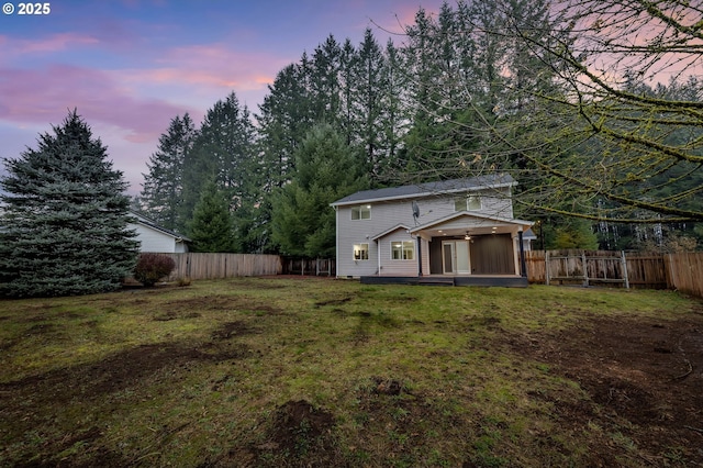 yard at dusk with a wooden deck