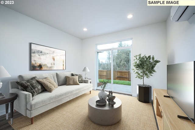 living room with an AC wall unit and recessed lighting