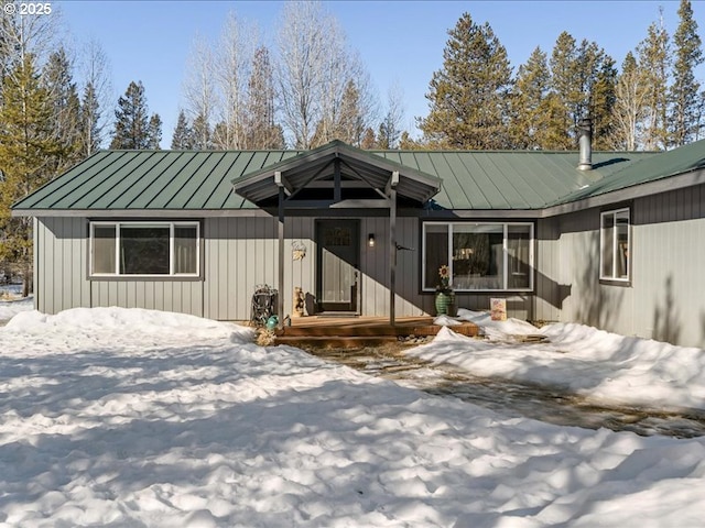 view of front facade with a standing seam roof and metal roof