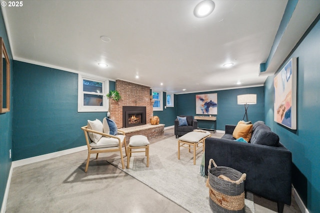 living room with a brick fireplace, recessed lighting, baseboards, and concrete floors