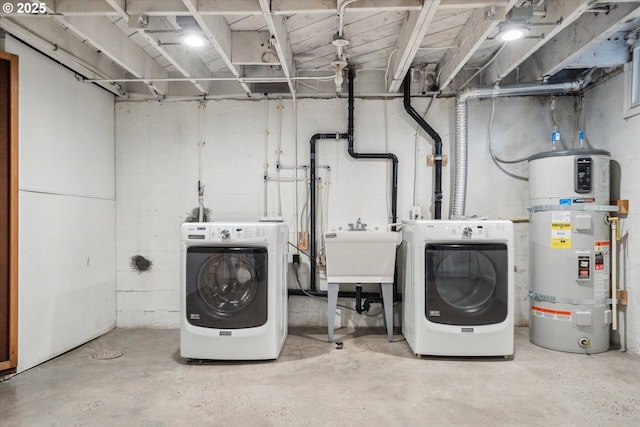 washroom featuring secured water heater and separate washer and dryer