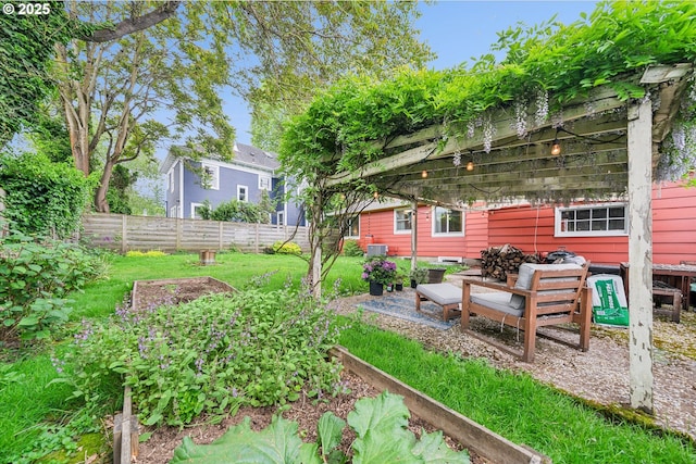 view of yard with fence and a garden