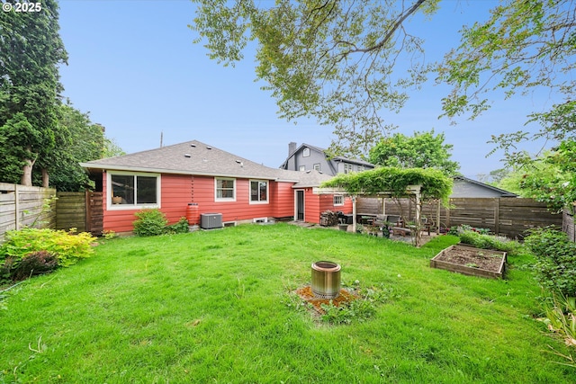 view of yard with a garden and cooling unit