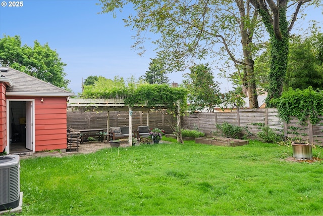 view of yard with a vegetable garden and cooling unit