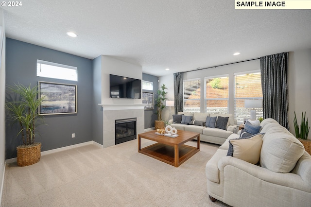 9203 S 3rd St Unit 113, Ridgefield, WA 98642 - living room with a textured ceiling, recessed lighting, a tile fireplace, carpet flooring, and healthy amount of natural light