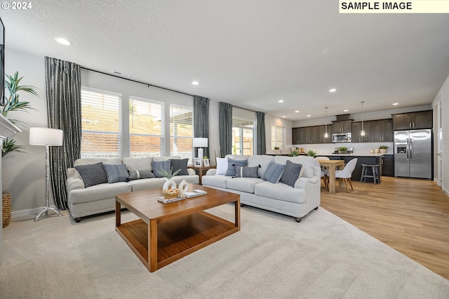 9203 S 3rd St Unit 113, Ridgefield, WA 98642 - living area featuring recessed lighting, light wood finished floors, and baseboards