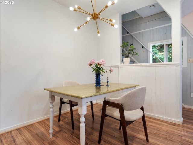 1171 Mabee Mines Rd, Washougal, WA 98671 - dining room featuring a chandelier, wood finished floors, and wood walls