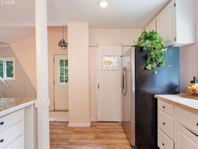 1171 Mabee Mines Rd, Washougal, WA 98671 - kitchen featuring freestanding refrigerator, light wood-style floors, light countertops, white cabinets, and recessed lighting