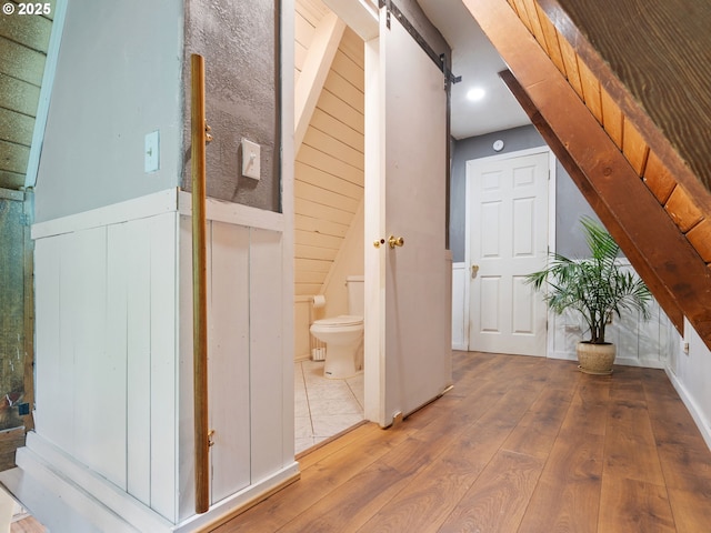 1171 Mabee Mines Rd, Washougal, WA 98671 - corridor featuring a barn door and hardwood / wood-style floors