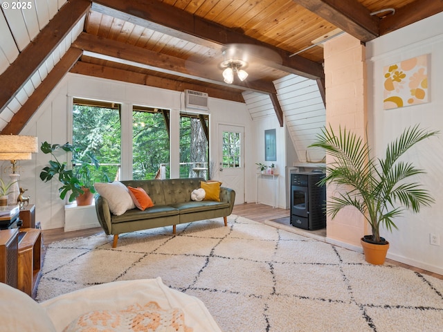 1171 Mabee Mines Rd, Washougal, WA 98671 - living area featuring wooden ceiling, a wood stove, a ceiling fan, a wall mounted air conditioner, and wood finished floors