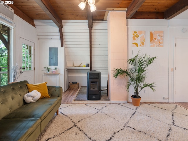 1171 Mabee Mines Rd, Washougal, WA 98671 - living area featuring a wood stove, electric panel, a wooden ceiling with exposed beams, wood finished floors, and ceiling fan