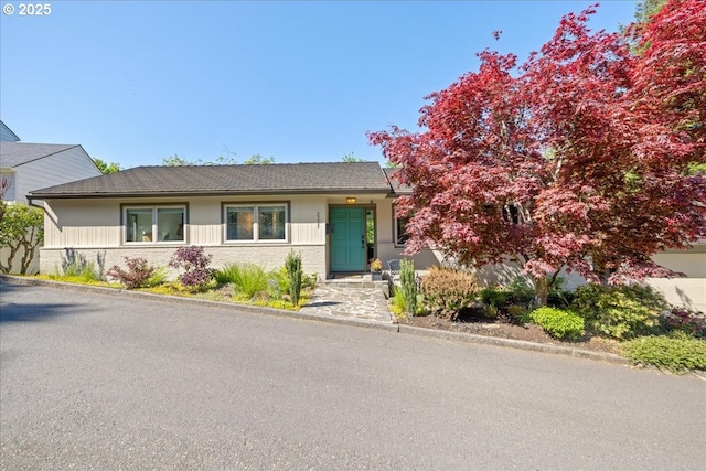 view of front of house with brick siding