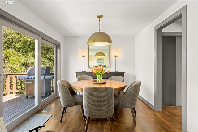 dining room with wood finished floors