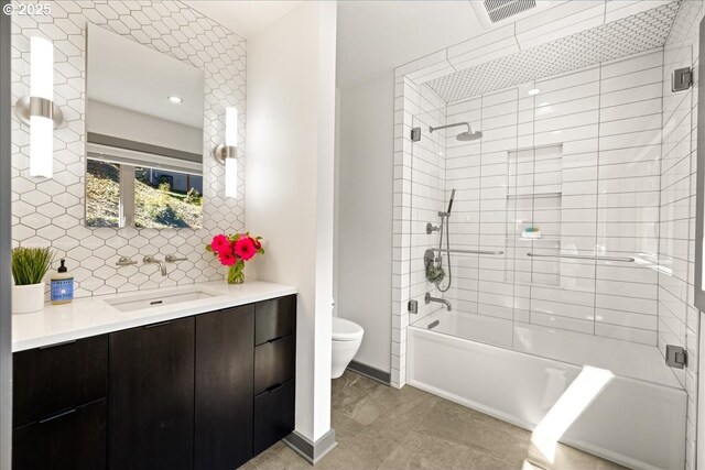 full bathroom featuring toilet, vanity,  shower combination, baseboards, and decorative backsplash