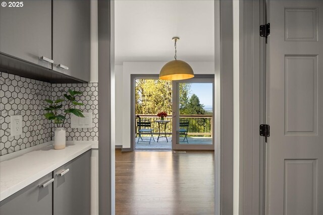 entryway with wood finished floors