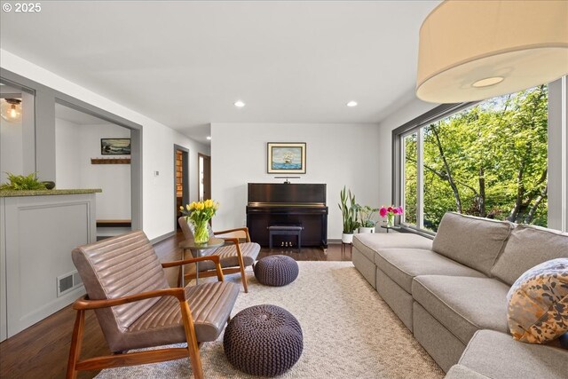 living area featuring wood finished floors and recessed lighting