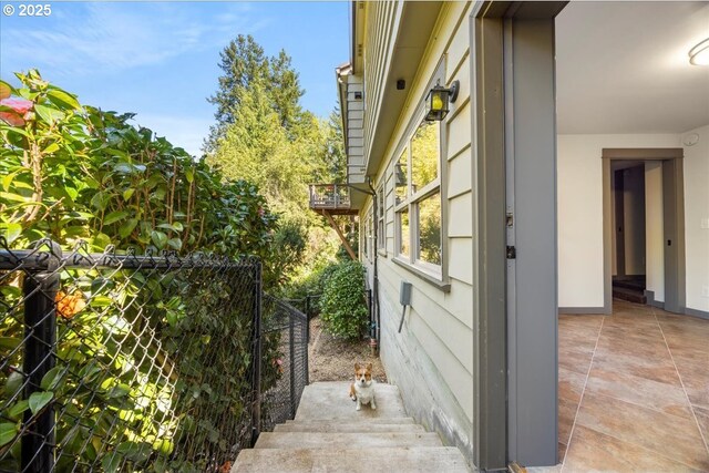 view of side of property with fence