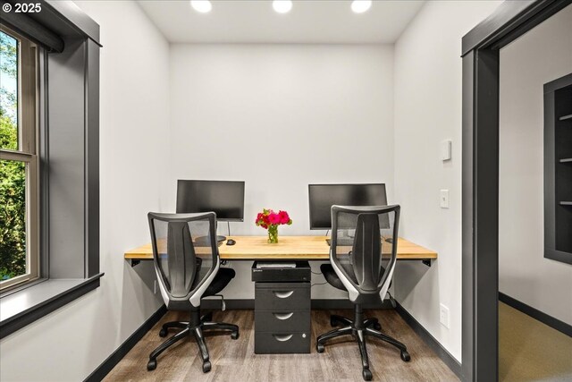 office space with wood finished floors, recessed lighting, and baseboards