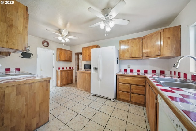 1305 E Van Buren Ave, Cottage Grove, OR 97424 - kitchen featuring white appliances, tile countertops, a sink, and a ceiling fan