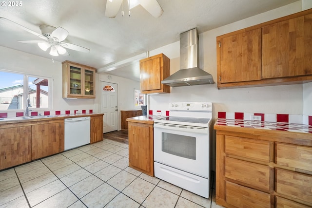 1305 E Van Buren Ave, Cottage Grove, OR 97424 - kitchen with wall chimney range hood, white appliances, a ceiling fan, light tile patterned flooring, and tile counters