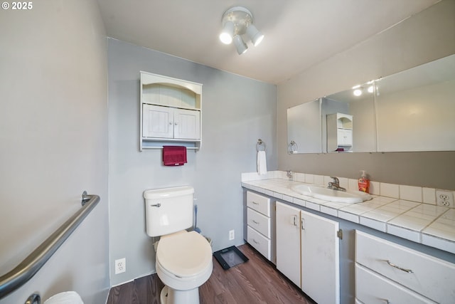 1305 E Van Buren Ave, Cottage Grove, OR 97424 - bathroom featuring wood finished floors, vanity, and toilet