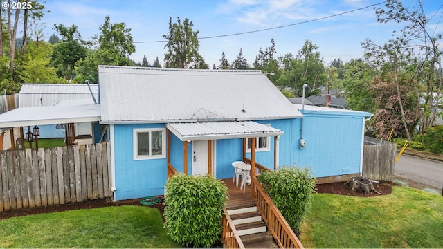 1305 E Van Buren Ave, Cottage Grove, OR 97424 - view of front of home with metal roof and a wooden deck