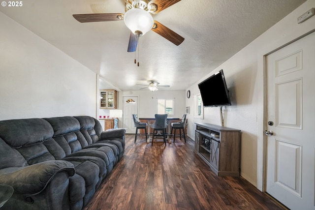 1305 E Van Buren Ave, Cottage Grove, OR 97424 - living area featuring a ceiling fan, dark wood-style floors, a textured ceiling, and baseboards