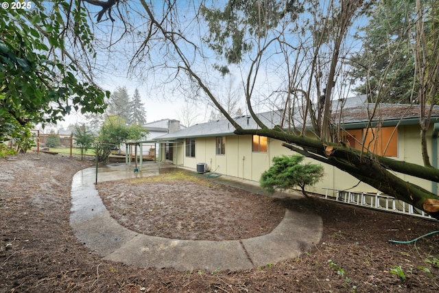 back of house featuring cooling unit and a patio area