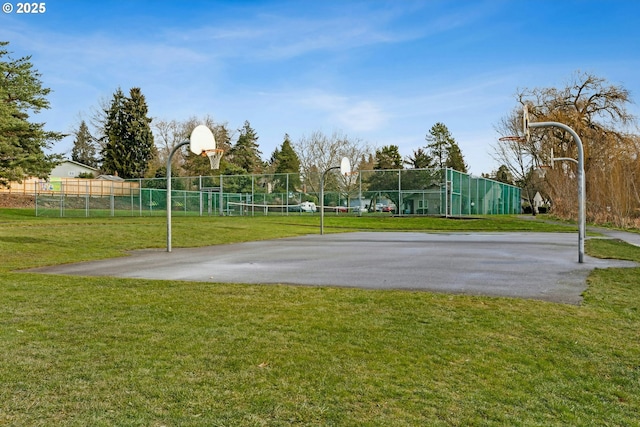 view of basketball court featuring a lawn