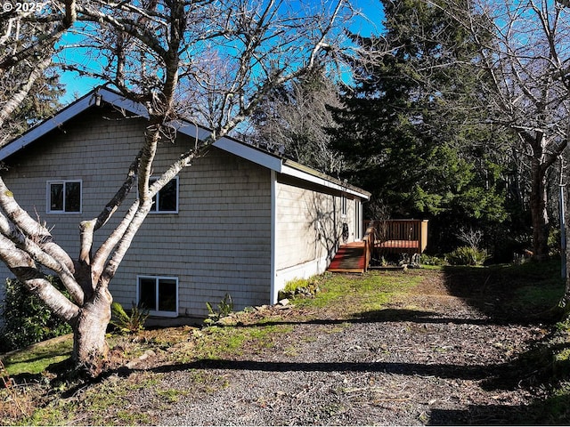 view of property exterior featuring a deck