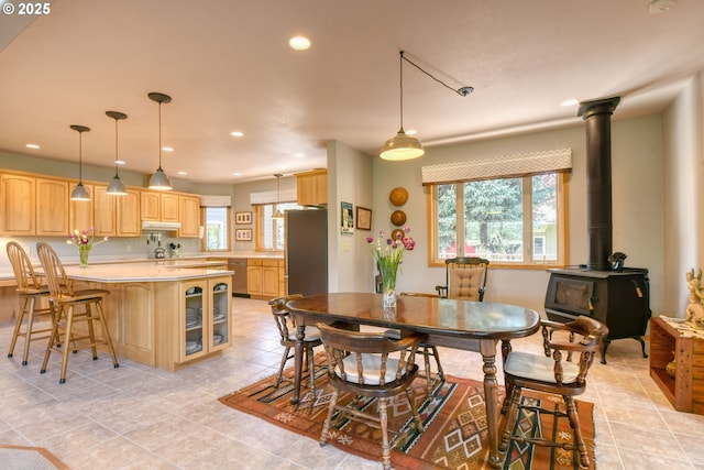 dining space featuring recessed lighting, plenty of natural light, and light tile patterned flooring
