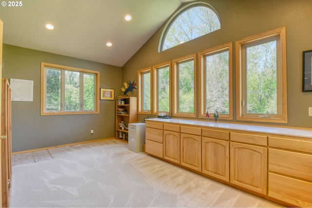 interior space featuring high vaulted ceiling, plenty of natural light, recessed lighting, and light colored carpet
