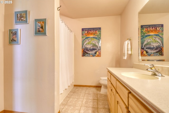 bathroom with tile patterned flooring, vanity, baseboards, toilet, and a shower with shower curtain