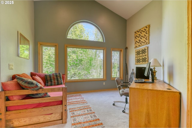 office with baseboards, carpet, and high vaulted ceiling