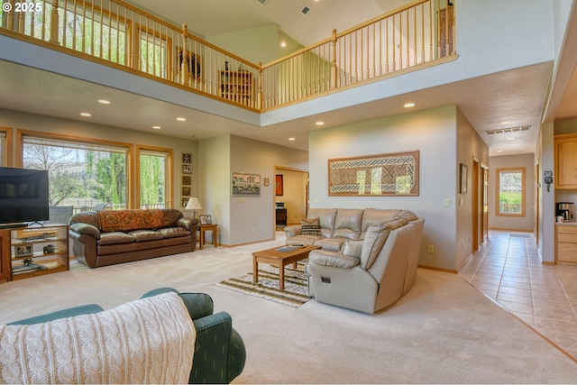 54693 Bingham Rd, Adams, OR 97810 - living room with light carpet, a towering ceiling, healthy amount of natural light, baseboards, and recessed lighting