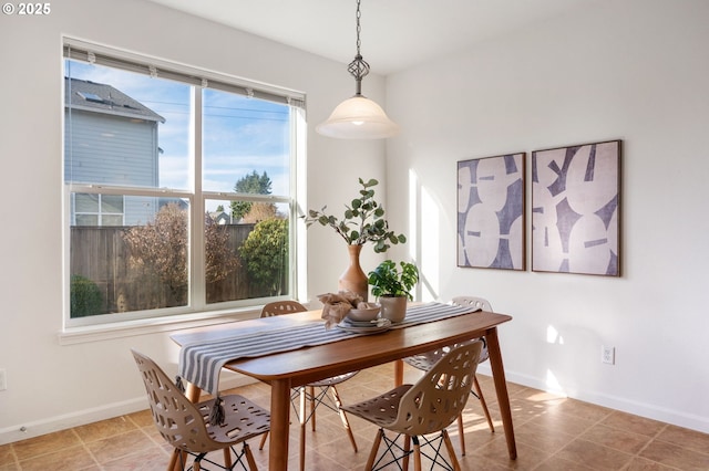 tiled dining space with baseboards