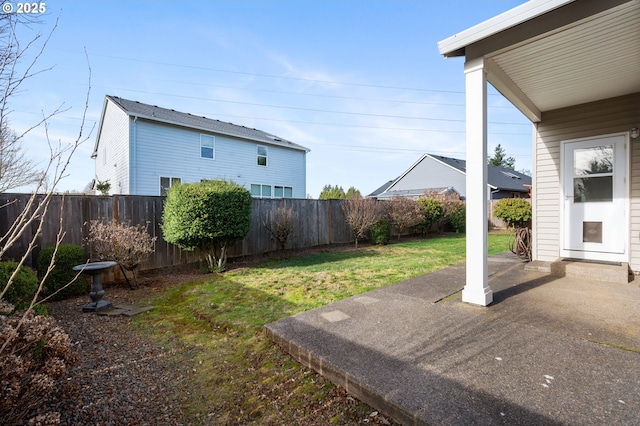 view of yard with a fenced backyard and a patio