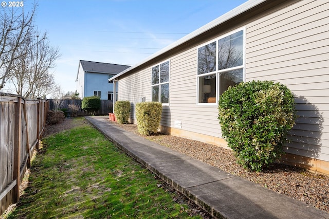 view of side of property with a fenced backyard