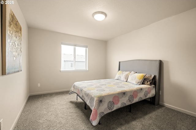 bedroom featuring carpet floors and baseboards