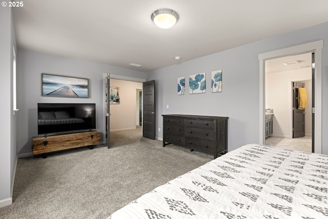 bedroom with light carpet and baseboards