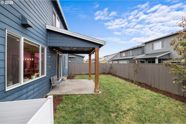 view of yard with a patio area and a fenced backyard